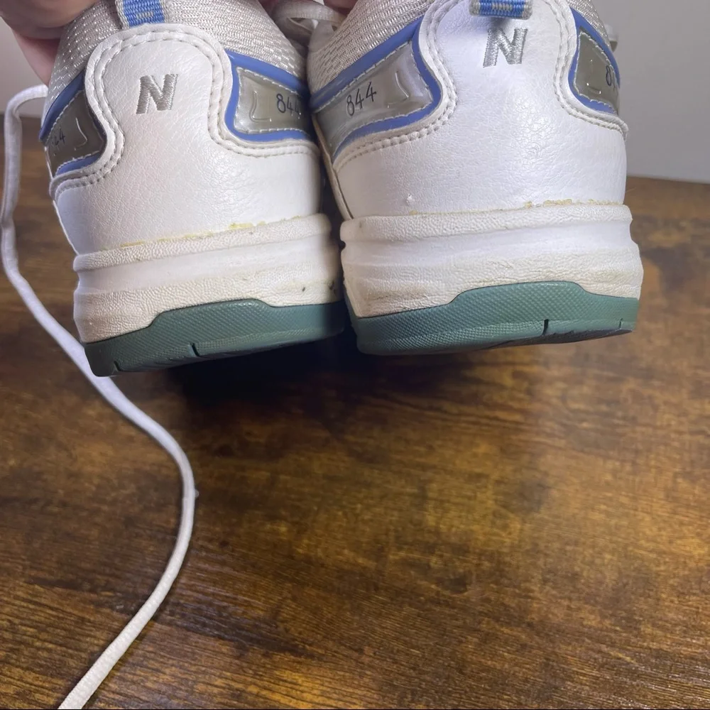 New Balance White Athletic Sneakers with Blue Accents